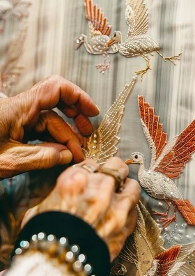 Hands crafting a legacy book